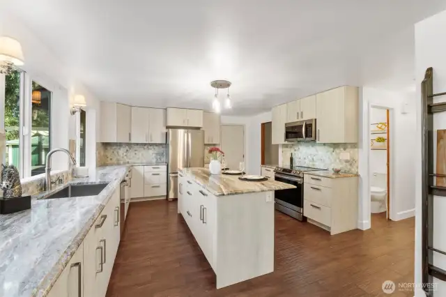 Luxurious granite tops and stainless appliances.