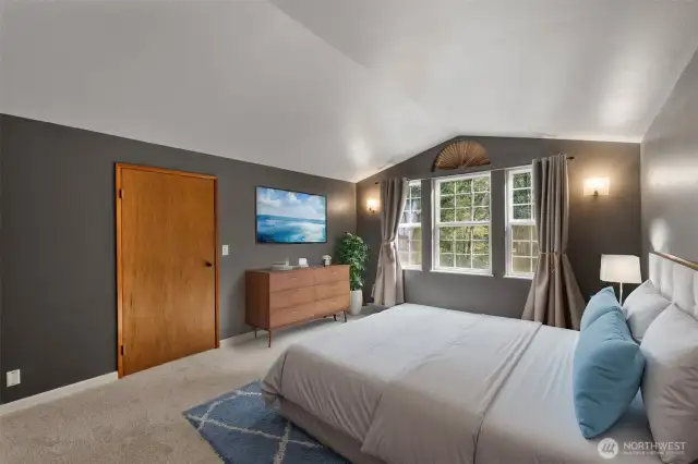 The Primary suite is spacious and offers views of the front yard as well as a walk-in closet and luxurious private bathroom.