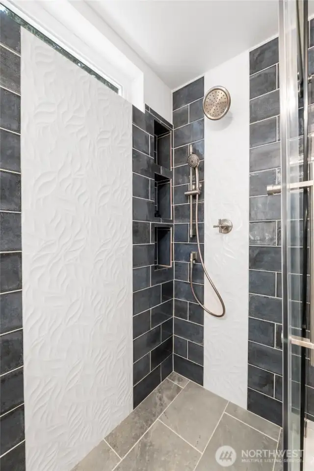 Beautiful tile detail in this glass shower.