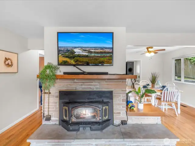 Nestled in the heart of the living space, this cozy wood stove adds both charm and function—perfect for curling up on chilly Pacific Northwest evenings.