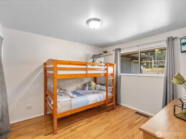 Generously sized and filled with natural light, this secondary bedroom offers endless versatility—perfect as a guest room, home office, or cozy retreat.