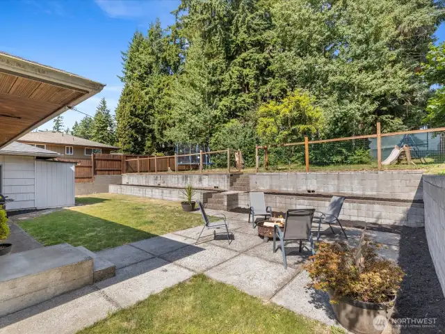 The true gem of this property is the expansive, fully fenced backyard that feels like your own private park.