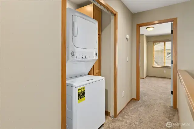 Washer & Dryer centrally located between both bedrooms on upper level.
