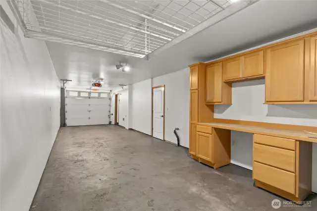 Garage with built in cabinets.