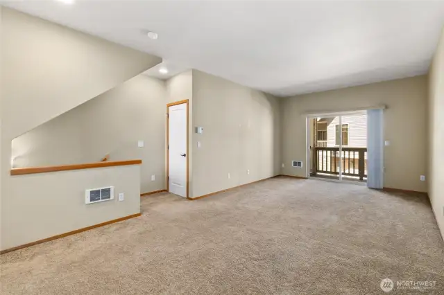 Living Room with Deck overlooking the back yard area.