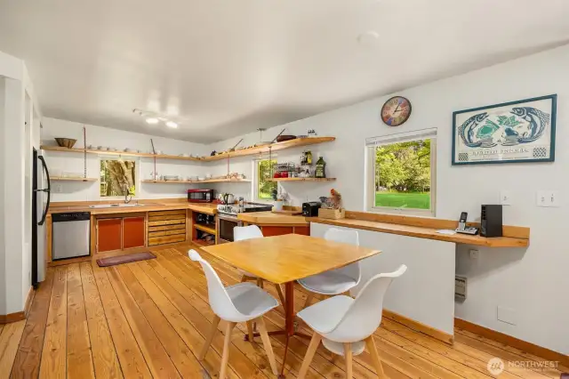 The large kitchen has room for in-kitchen dining. A glass door leads to the front yard- out of view.
