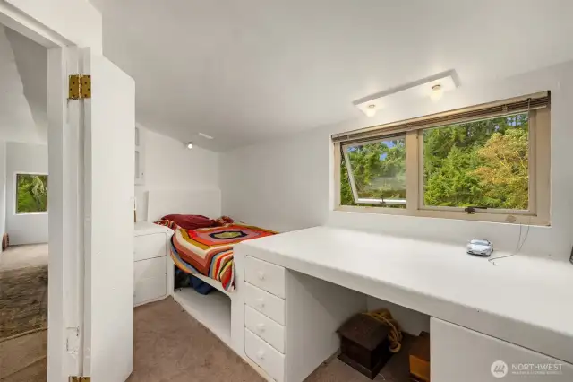 Second small bedroom on the upper level with large built in desk. Could be a home office. Not counted in bedroom count.