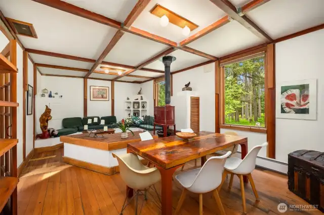 The dining room also has boxed beam ceilings and old style wood floors.