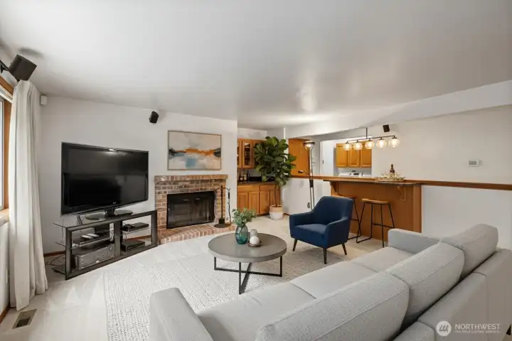 Virtually staged living room off the kitchen