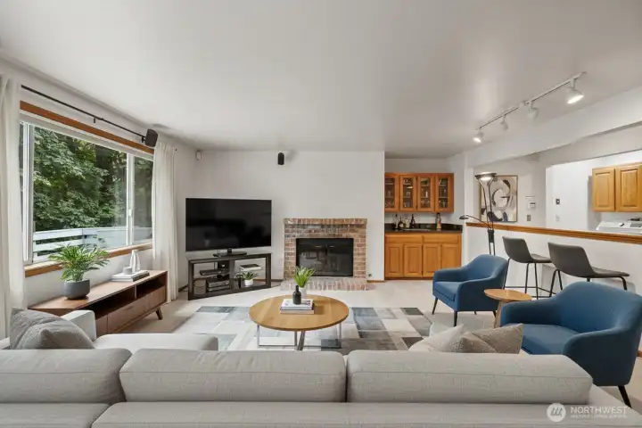 Nice cozy wood burning fireplace in the virtually staged living room