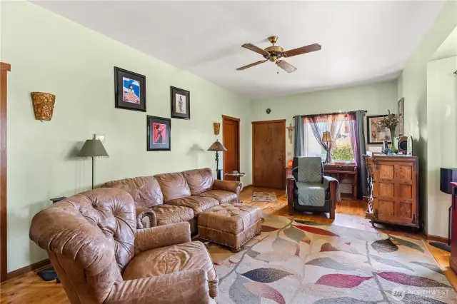 Living room with primary bedroom by the front door.