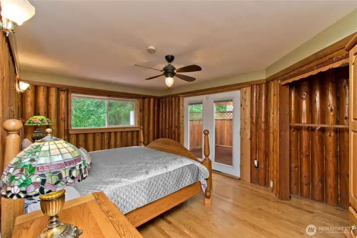 Primary bedroom with french doors to the hot tub.