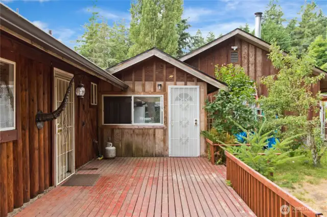 Backyard deck and access to finished extra room.