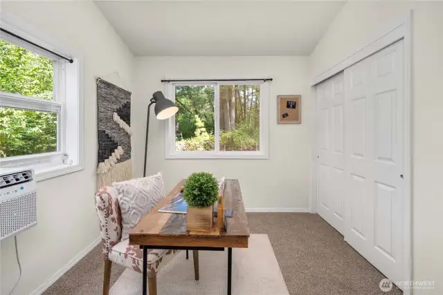 Bedroom on the main level - staged as an office.