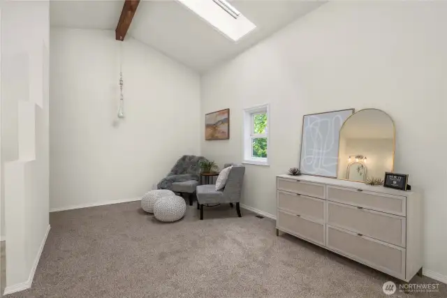 Primary bedroom room with sitting area.
