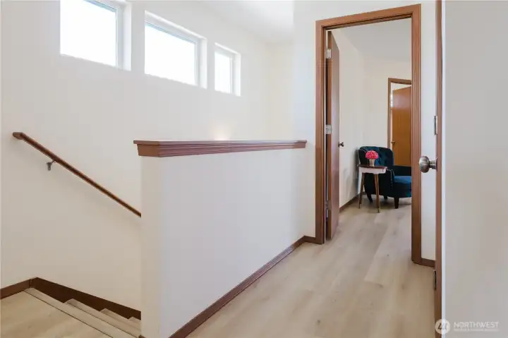 Stairs with the hat to the primary bedroom, linen closet on the right..