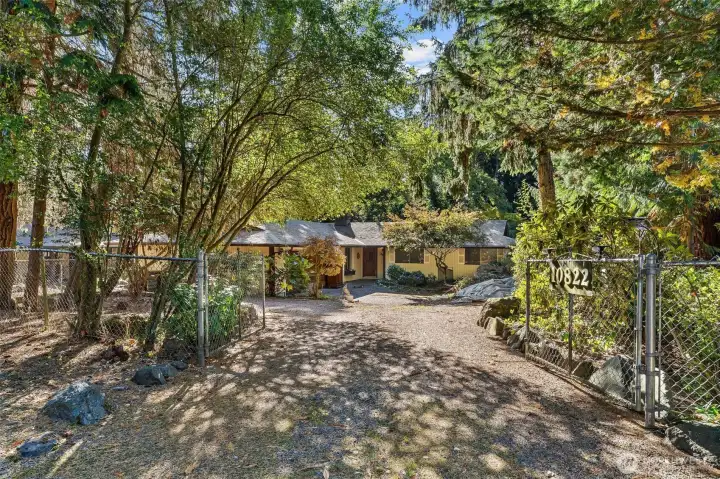Welcome Home! Which is located in a private & secluded location. Starting with a gate that opens to your future personal retreat. With established flowers, trees & greenery to enjoy all year round. This home was meant for a car enthusiast, a hobbiest or whatever your heart desires!