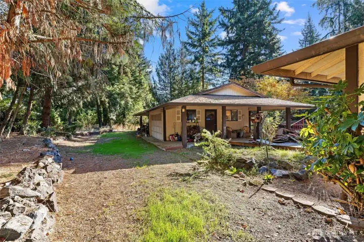 side back yard with carport and covered seating area