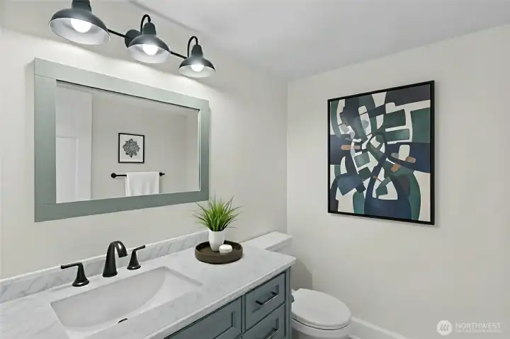 Convenient main-floor half bath with updated finishes and fresh paint Virtually Staged