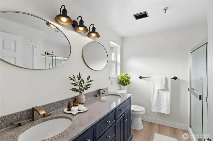 Refreshed primary bathroom with modern updates and clean, bright finishes. Virtually Staged