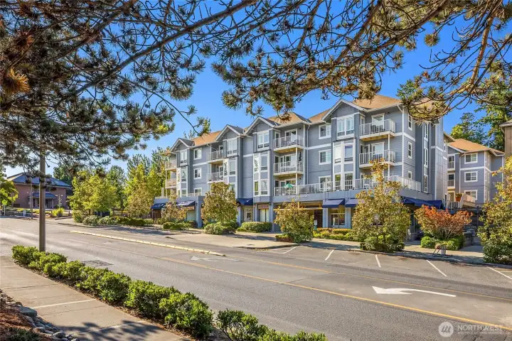 Perched on the peaceful Top-Floor of Island Crossings Complex,  this 1- bed beauty is pure, move-in-ready glam—easy one-level living steps from shops, dining, the library and the Sound-to-Olympic Trail.