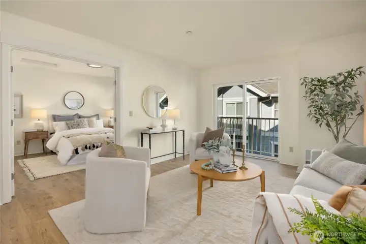 Double doors lead to the generous primary suite. Beautiful Pergo flooring.