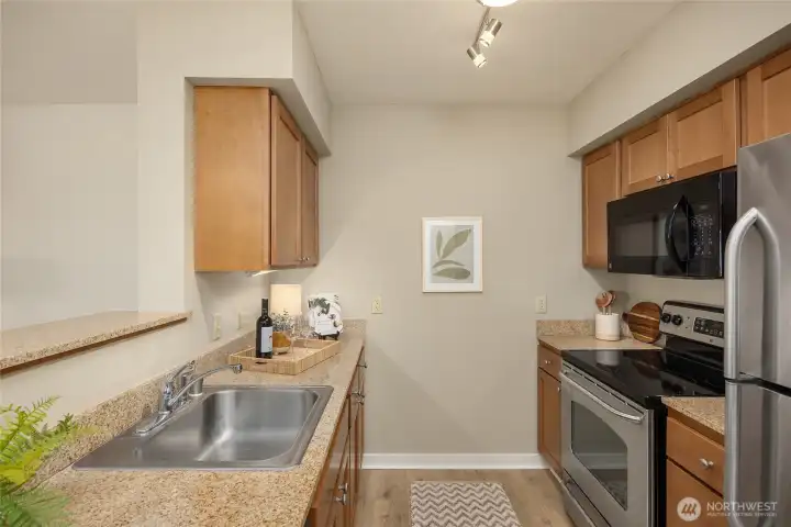 A galley kitchen features everything at your finger tips.