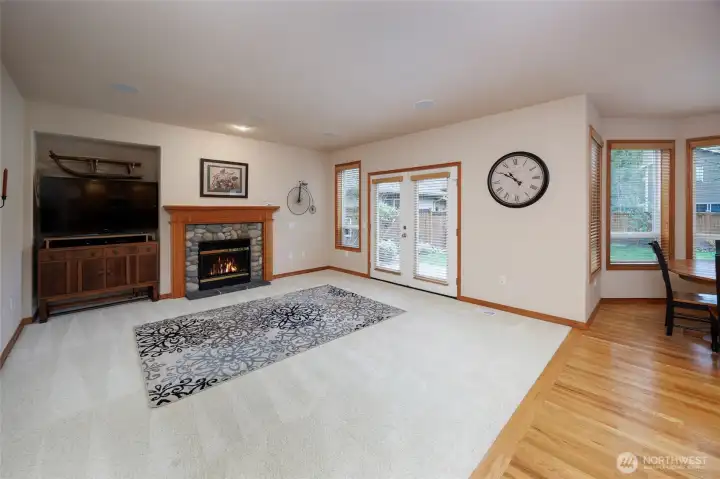 Family room w/gas rock fireplace & French doors to bacyard/patio.