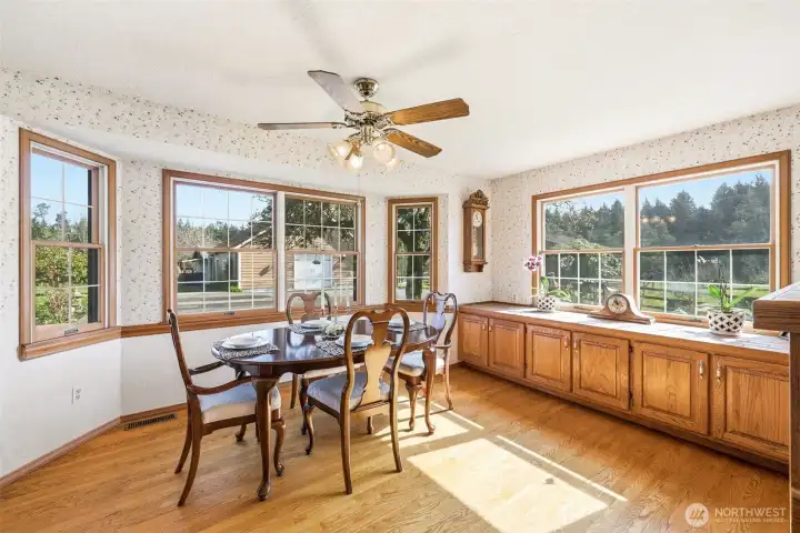 The country dining room has plenty of windows to over look the charming farm.