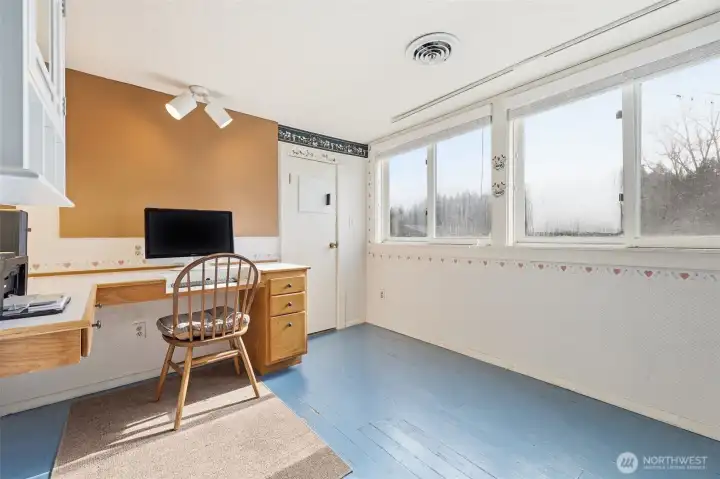Used as an office, this room is off of one of the upper bedrooms. This could be a nursery or a walk-in closet.
