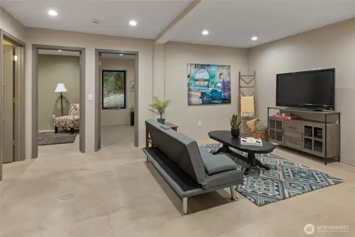 Here in the basement the home has 2 bedrooms, a reck room, a full bath, laundry room and mechanical room. This is a large living space on the lowest floor.