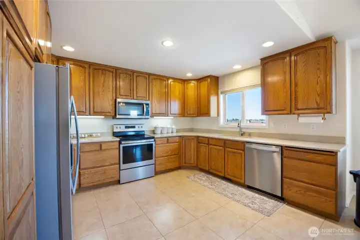 Large, spacious kitchen with stainless steel appliances