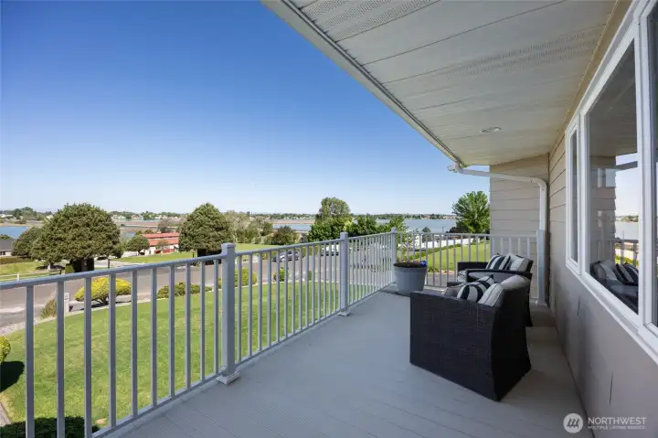Deck off of upper level with gorgeous panoramic Lake views