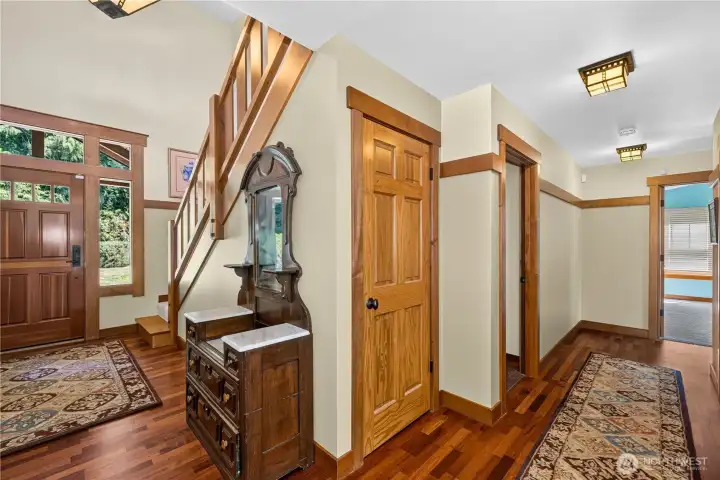 Front entry - look at that gorgeous woodwork! Den is to the left of the front door and hall leads to the primary bedroom suite. Front entry - look at that gorgeous woodwork! Den is to the left of the front door and hall leads to the primary bedroom suite.