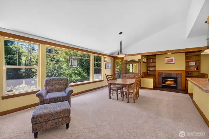 Living and Dining area with fireplace just off kitchen faces the beautiful back deck and forest Living and Dining area with fireplace just off kitchen faces the beautiful back deck and forest
