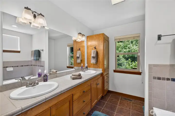 Primary bathroom features double vanities, with separate shower and tub areas - set up your own spa experience! Primary bathroom features double vanities, with separate shower and tub areas - set up your own spa experience!