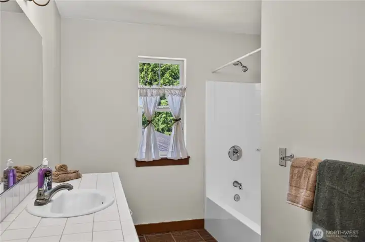 The upstairs bathroom has plenty of room to relax and rejuvenate. The upstairs bathroom has plenty of room to relax and rejuvenate.