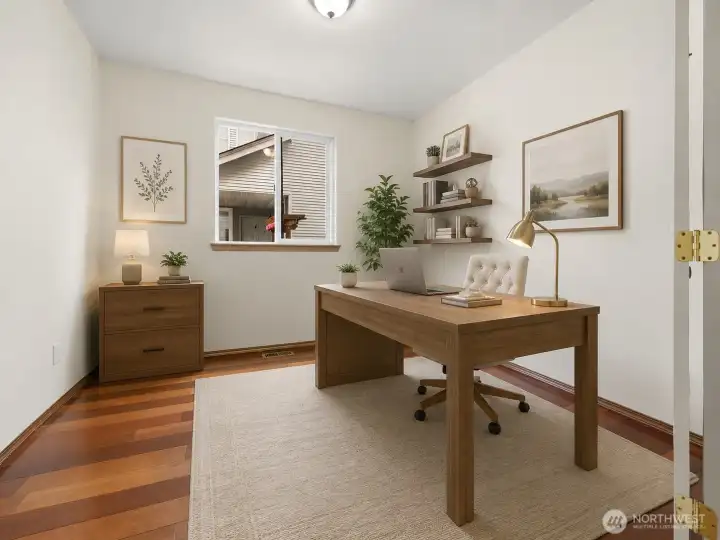 Virtually staged main floor room as an office