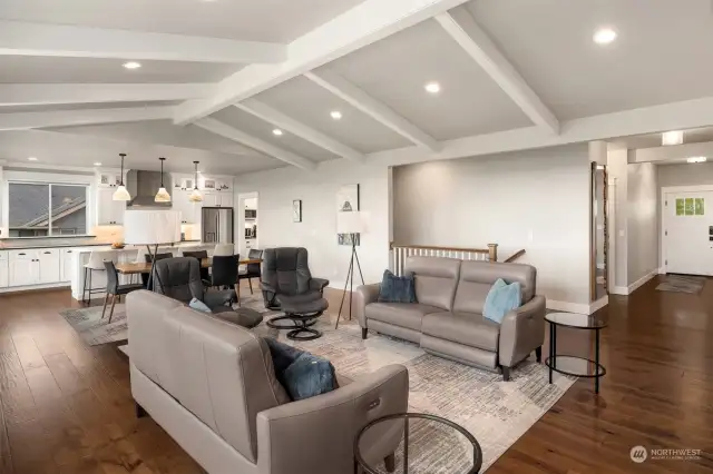 Experience the allure of an open concept living space complemented by exquisite hand-scraped wood floors.