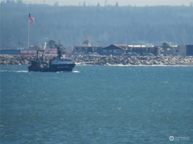 SMALLER FISHING VESSEL GOING OUT TO SEA TO FISH!