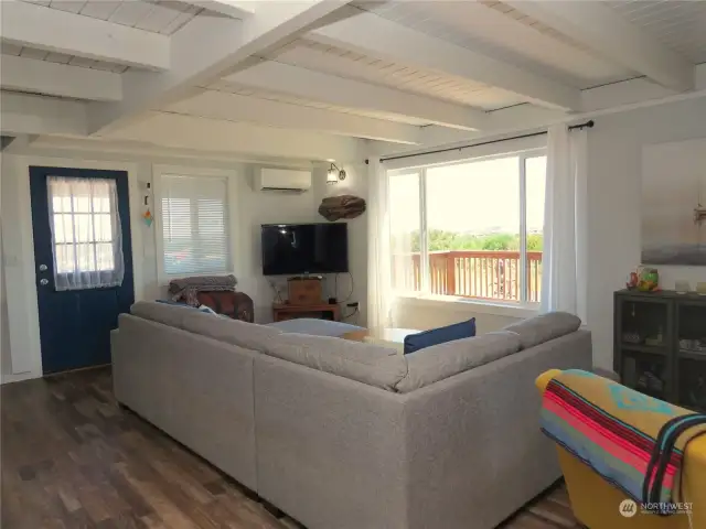 INSIDE IS THE OPEN CONCEPT LIVING SPACE WITH WINDOWS FACING THE JETTY FOR GORGEOUS VIEWS OF VESSELS GOING IN AND OUT OF PORT! NOTE THE DUCTLESS HEATING AND AIR IN THE CORNER!