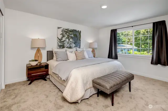 Spacious primary bedroom offering a serene retreat with ample space and inviting ambiance.