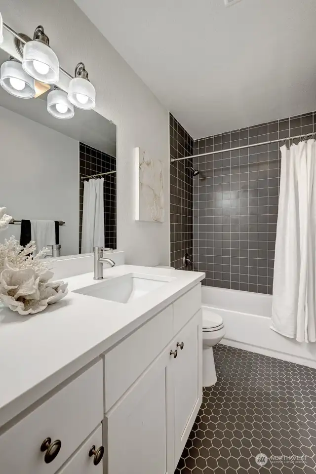 Modern downstairs bathroom featuring sleek finishes and stylish design for a fresh, functional space.