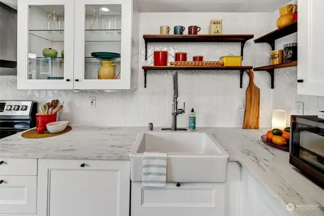 Updated kitchen with lighted cabinets and tons of storage.