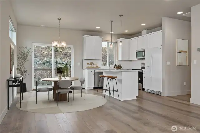 Kitchen and Dining area viewed from the Living Room (virtually staged)