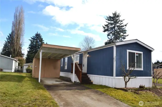 The large storage shed and carport go with the lot.