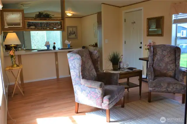 View of the living room looking towards the kitchen and front door.