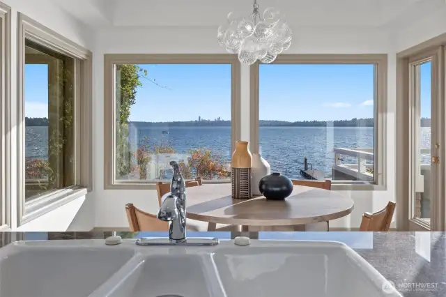 Even everyday moments feel elevated—wash dishes while taking in spectacular lake and city views from this beautifully updated kitchen.