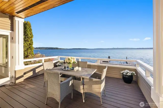 Main floor large Trex deck offers al fresco dining with expansive waterfront views—every day feels like a getaway.