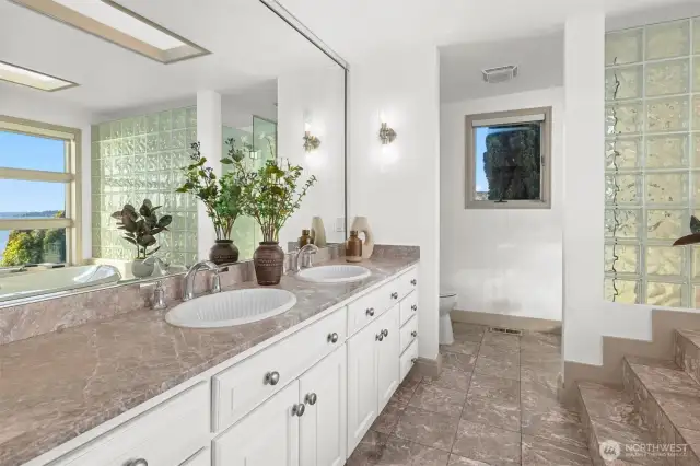 Enjoy the luxury of a light-filled 5-piece ensuite, complete with skylights and generous space to unwind.